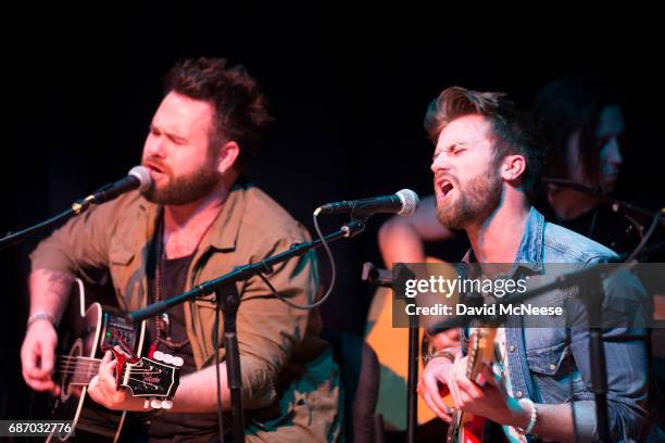 Swon Brothers preform at a music industry meet up featuring a songwriters in the round special performance at Woody Guthrie Center on May 22, 2017 in...