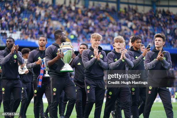 Chelsea's triple cup winning U18 squad parade their trophies at half-time during the Premier League match between Chelsea and Sunderland at Stamford...