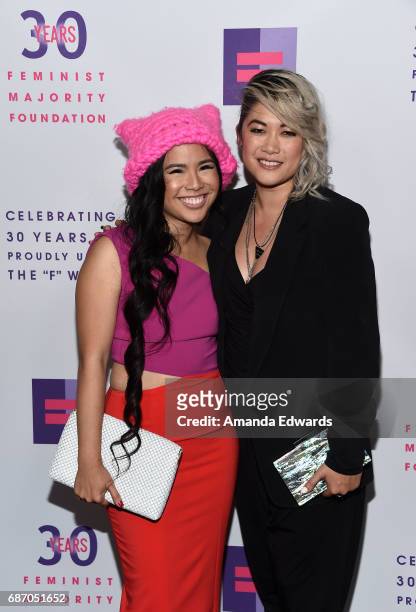 The Pussyhat Project founder Krista Suh and singer-songwriter MILCK arrive at the Feminist Majority Foundation 30th Anniversary Celebration at the...