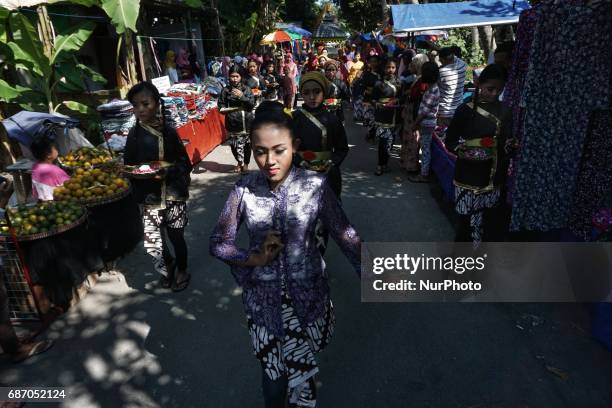 Javanese follows Nyadran ritual at Sewu Cemetery, Yogyakarta, Indonesia on May 22, 2017. Nyadran ritual is a tradition to clean up and pray to their...