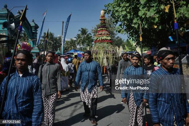 Javanese follows Nyadran ritual at Sewu Cemetery, Yogyakarta, Indonesia on May 22, 2017. Nyadran ritual is a tradition to clean up and pray to their...