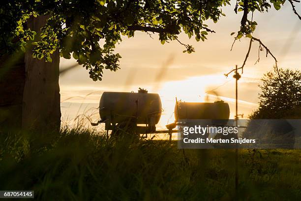 fertilizer cars in farm field at sunset - carbon capture stock pictures, royalty-free photos & images