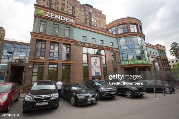 The logo of the Zenden Group footware chain sits on display outside a Zenden shoe store in Moscow, Russia, on Friday, May 19, 2017. The low-budget...