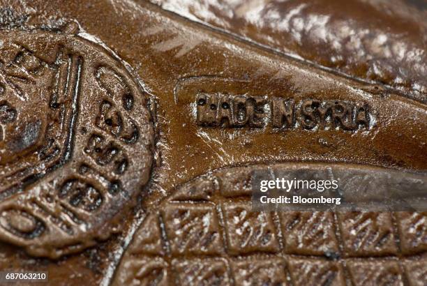 Made in Syria' stamp sits on the sole of a shoe for sale inside a Zenden shoe store in Moscow, Russia, on Friday, May 19, 2017. The low-budget...