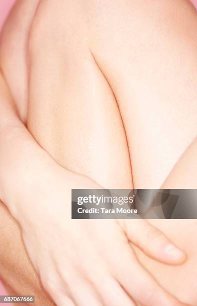 woman legs curled up - bent hand stock pictures, royalty-free photos & images