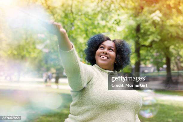 #muslimgirl with bubbles - fat black girl stock pictures, royalty-free photos & images