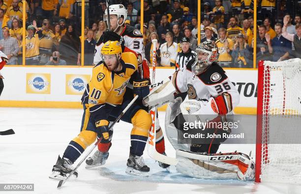 Colton Sissons of the Nashville Predators battles in front of goalie John Gibson of the Anaheim Ducks in Game Four of the Western Conference Final...
