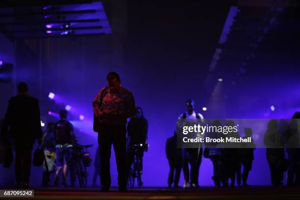 Pedestrians walk through a light installation ahead of Vivid Sydney at Barangaroo on May 23, 2017 in Sydney, Australia. Vivid Sydney is an annual...