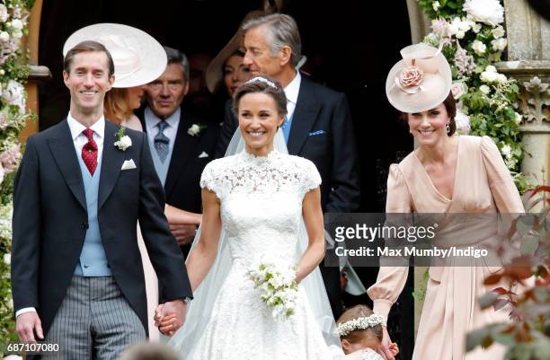 James Matthews and Pippa Middleton leave St Mark's Church along with Catherine, Duchess of Cambridge after their wedding on May 20, 2017 in...