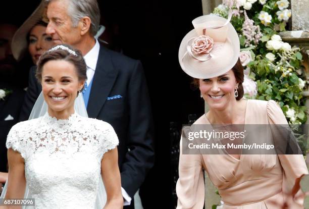 Pippa Middleton leaves St Mark's Church accompanied by Catherine, Duchess of Cambridge after her wedding on May 20, 2017 in Englefield Green, England.