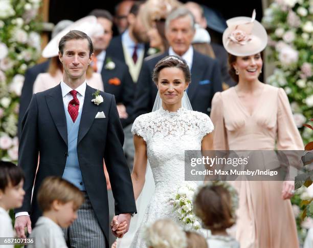 James Matthews and Pippa Middleton leave St Mark's Church along with Catherine, Duchess of Cambridge after their wedding on May 20, 2017 in...