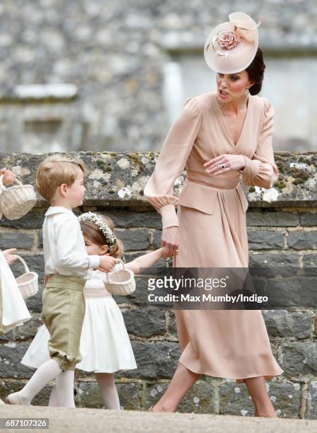 Catherine, Duchess of Cambridge, Prince George of Cambridge and Princess Charlotte of Cambridge attend the wedding of Pippa Middleton and James...