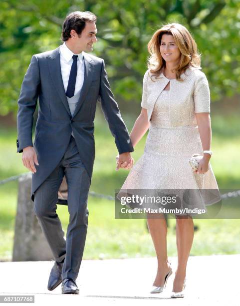 Roger Federer and Mirka Federer attend the wedding of Pippa Middleton and James Matthews at St Mark's Church on May 20, 2017 in Englefield Green,...