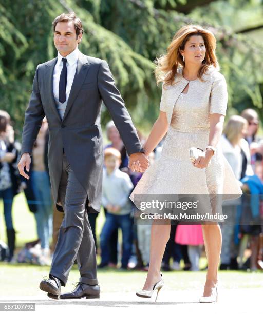 Roger Federer and Mirka Federer attend the wedding of Pippa Middleton and James Matthews at St Mark's Church on May 20, 2017 in Englefield Green,...