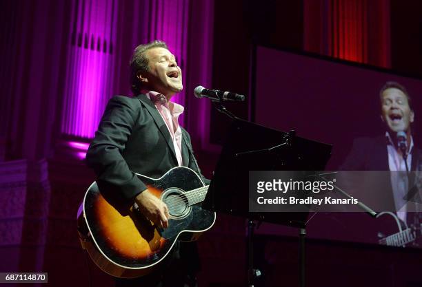 Country musician Troy Cassar-Daley performs during the Queensland Maroons State of Origin official launch at the Brisbane City Town Hall on May 23,...