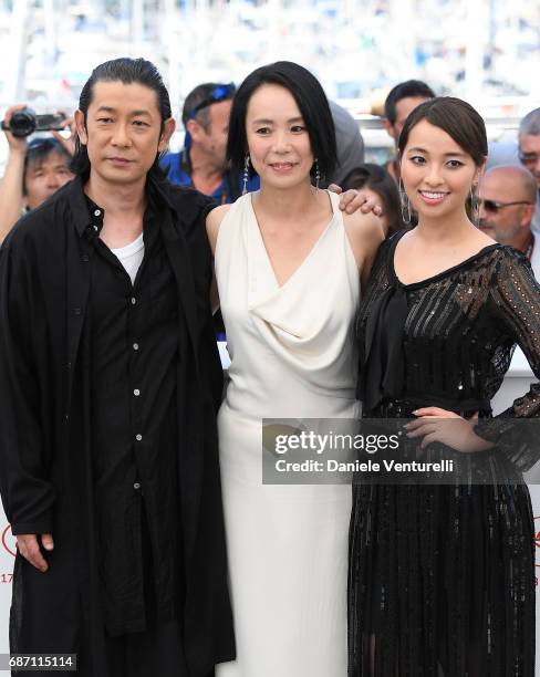 Actors Nagase Masatoshi, Director Naomi Kawase and Ayame Misaki attend the "Hikari " photocall during the 70th annual Cannes Film Festival at Palais...