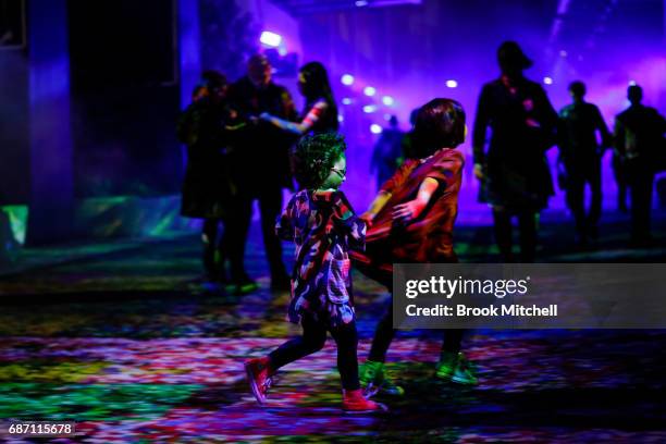 Children enjoying a light installation ahead of Vivid Sydney at Barangaroo on May 23, 2017 in Sydney, Australia. Vivid Sydney is an annual festival...