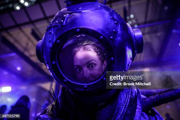 Character dressed for the media preview of the Vivid Festival installation What Lies Beneath at Barangaroo Park, Sydney. The piece is described as a...