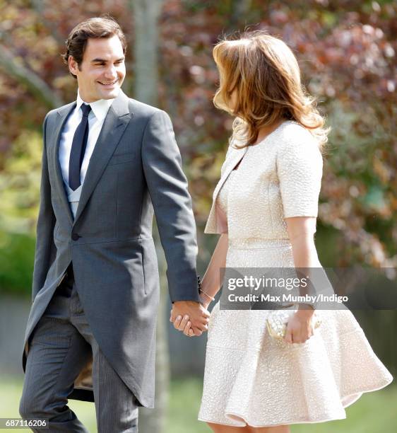 Roger Federer and Mirka Federer attend the wedding of Pippa Middleton and James Matthews at St Mark's Church on May 20, 2017 in Englefield Green,...