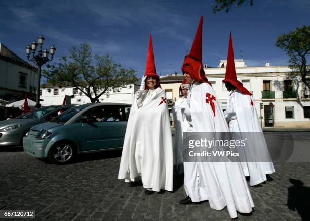 Penitents take part in the El Impertinente brotherhood before the procession during the Holy Week in Jeres de la Fronteira.
