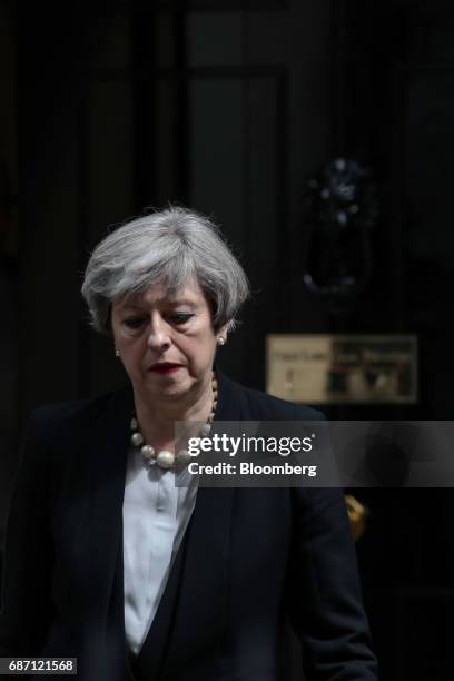 Theresa May, U.K. Prime minister, leaves number 10 Downing Street to deliver a statement in London, U.K., on Tuesday, May 23, 2017. At least 22...