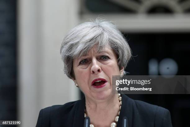 Theresa May, U.K. Prime minister, delivers a statement outside number 10 Downing Street in London, U.K., on Tuesday, May 23, 2017. At least 22 people...