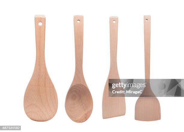 wooden kitchen utensils on white background - spatola foto e immagini stock