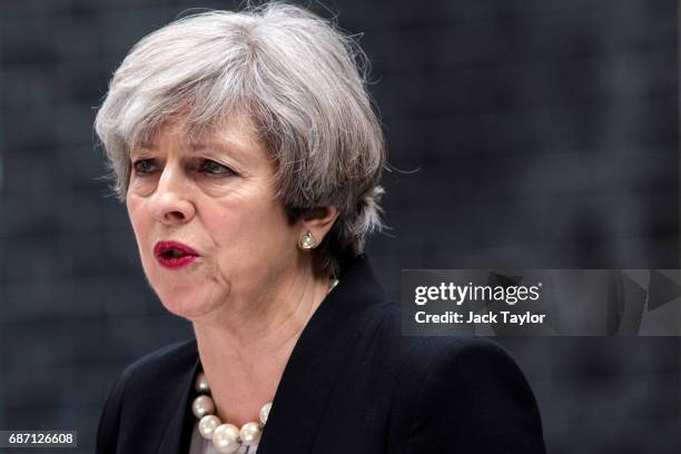 British Prime Minister Theresa May makes a statement in Downing Street after chairing a COBRA meeting on May 23, 2017 in London, England. 22 people,...