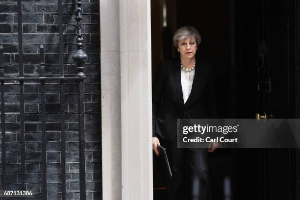 Britain's Prime Minister Theresa May addresses the media as she makes a statement in Downing Street following a COBRA meeting to discuss the...