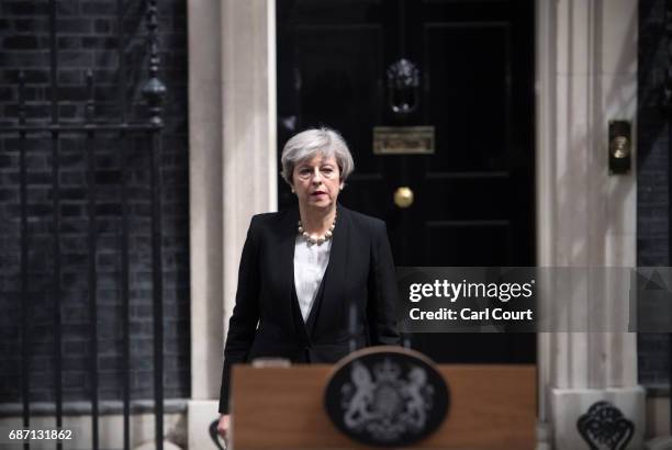 Britain's Prime Minister Theresa May prepares to address the media as she makes a statement in Downing Street following a COBRA meeting to discuss...