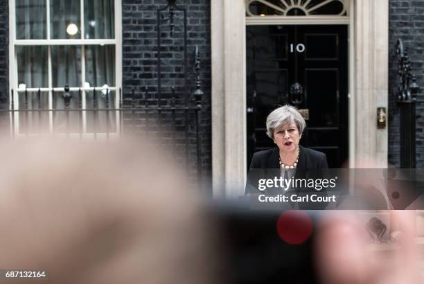 Britain's Prime Minister Theresa May addresses the media as she makes a statement in Downing Street following a COBRA meeting to discuss the...