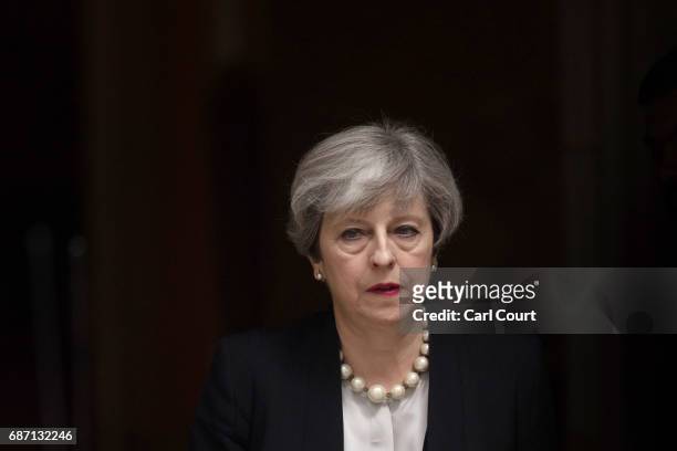 Britain's Prime Minister Theresa May leaves Downing Street after addressing the media following a COBRA meeting to discuss the government's response...