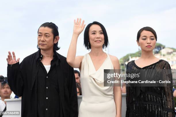 Nagase Masatoshi, Director Naomi Kawase and Ayame Misaki attend the "Hikari " photocall during the 70th annual Cannes Film Festival at Palais des...