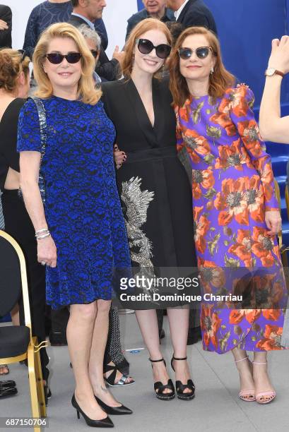 Actresses Catherine Deneuve, Jessica Chastain and Isabelle Huppert attend the 70th Anniversary Photocall during the 70th annual Cannes Film Festival...