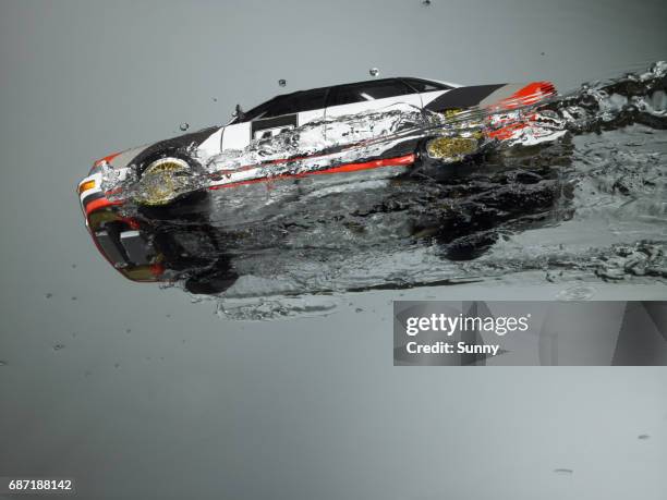 rally race car flying through water - sports car photos et images de collection