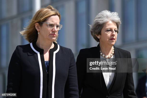 Home Secretary Amber Rudd and Britain's Prime Minister Theresa May make their way to meet Chief Constable of Greater Manchester Police Ian Hopkins on...