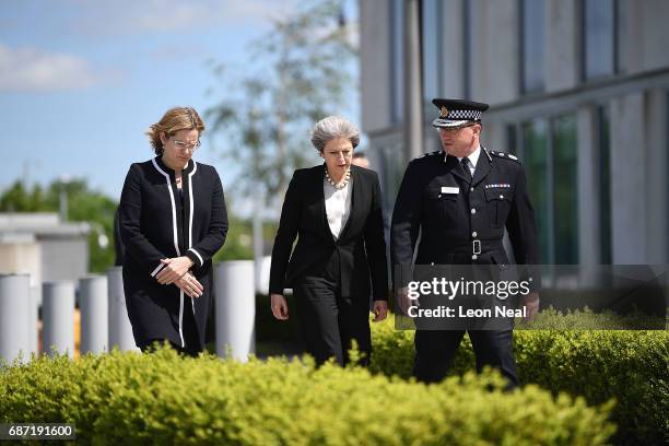 Home Secretary Amber Rudd and Britain's Prime Minister Theresa May meet Chief Constable of Greater Manchester Police Ian Hopkins on May 23, 2017 in...