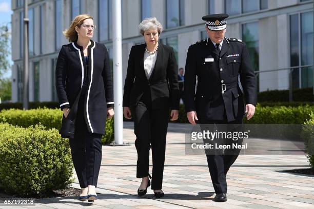 Home Secretary Amber Rudd and Britain's Prime Minister Theresa May make their way to meet Chief Constable of Greater Manchester Police Ian Hopkins on...