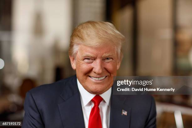 Portrait of American real estate developer and President-elect Donald Trump as he poses in his office at Trump Tower, New York, New York, November...