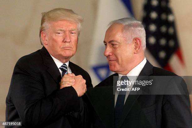President Donald Trump and Israel's Prime Minister Benjamin Netanyahu shake hands after delivering a speech at the Israel Museum in Jerusalem on May...