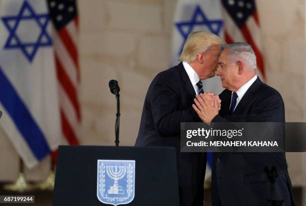 President Donald Trump and Israel's Prime Minister Benjamin Netanyahu shake hands after delivering a speech at the Israel Museum in Jerusalem on May...