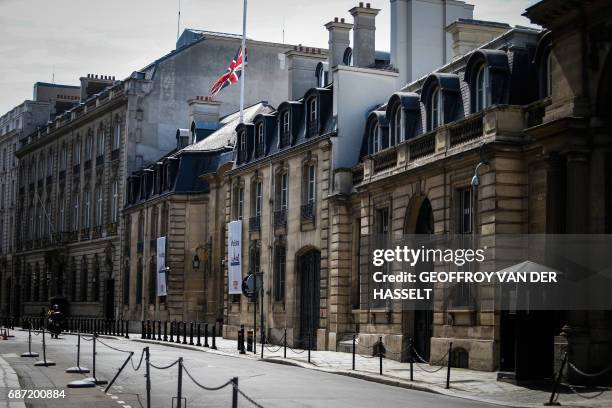 The Union Jack flies at half-mast above the British Embassy in Paris on May 23 as a mark of respect to those killed and injured in the terror attack...