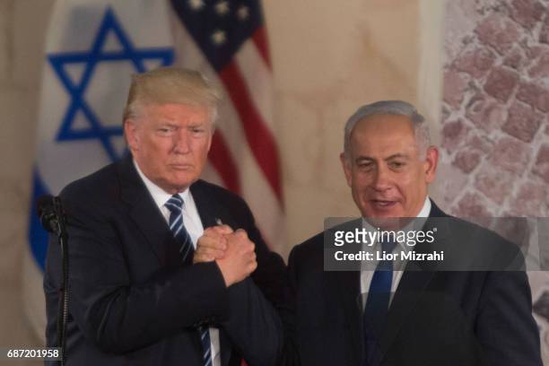 President Donald Trump and Israel's Prime Minister Benjamin Netanyahu shake hands after delivering a speech during a visit to the Israel Museum on...