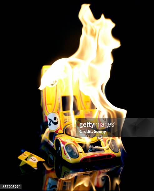 burning racecar - toy car accident stock pictures, royalty-free photos & images
