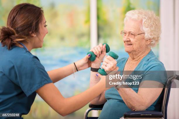 100-year-old woman and her home healthcare physical therapist. - images of the year 2014 sport stock pictures, royalty-free photos & images