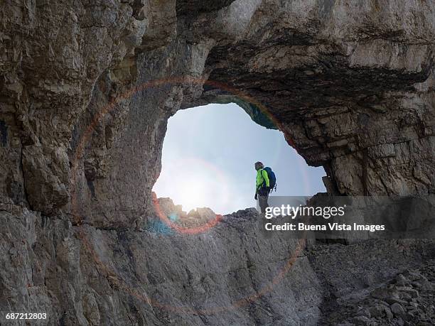 climber  ion a rocky ridge - great effort stock pictures, royalty-free photos & images