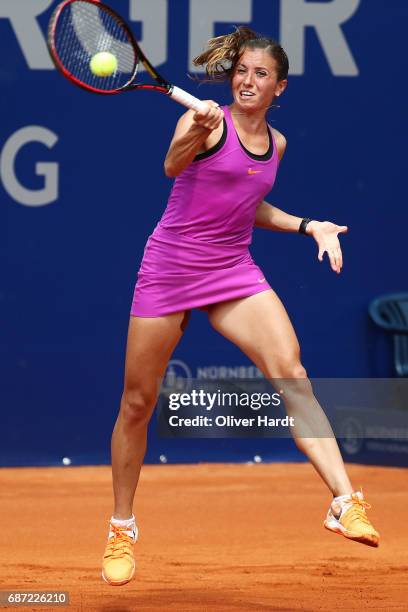 Annika Beck of Germany in action against Lena Rueffer of Germany in the first round during the WTA Nuernberger Versicherungscup on May 23, 2017 in...