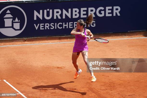 Annika Beck of Germany in action against Lena Rueffer of Germany in the first round during the WTA Nuernberger Versicherungscup on May 23, 2017 in...