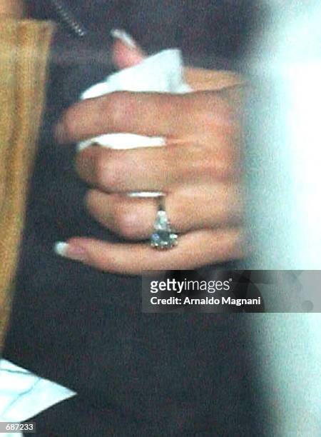 New York Yankee first baseman Jason Giambis fiancee Kristian Rice sports a large engagement ring as she leaves leave the Regency Hotel with Giambi...