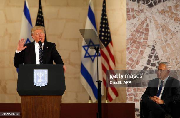 Israel's Prime Minister Benjamin Netanyahu listens as US President Donald Trump delivers a speech at the Israel Museum in Jerusalem on May 23, 2017.
